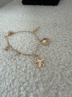 Bracelet charms doré - Étoile de mer Maddy & Co